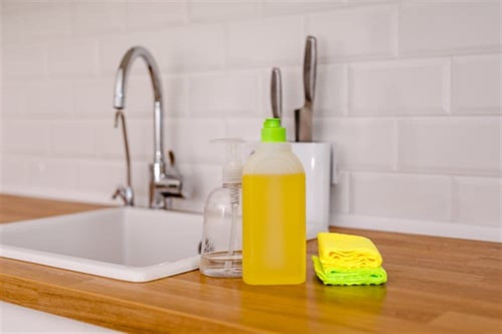 Bright kitchen with white tile after an AHC deep cleaning service