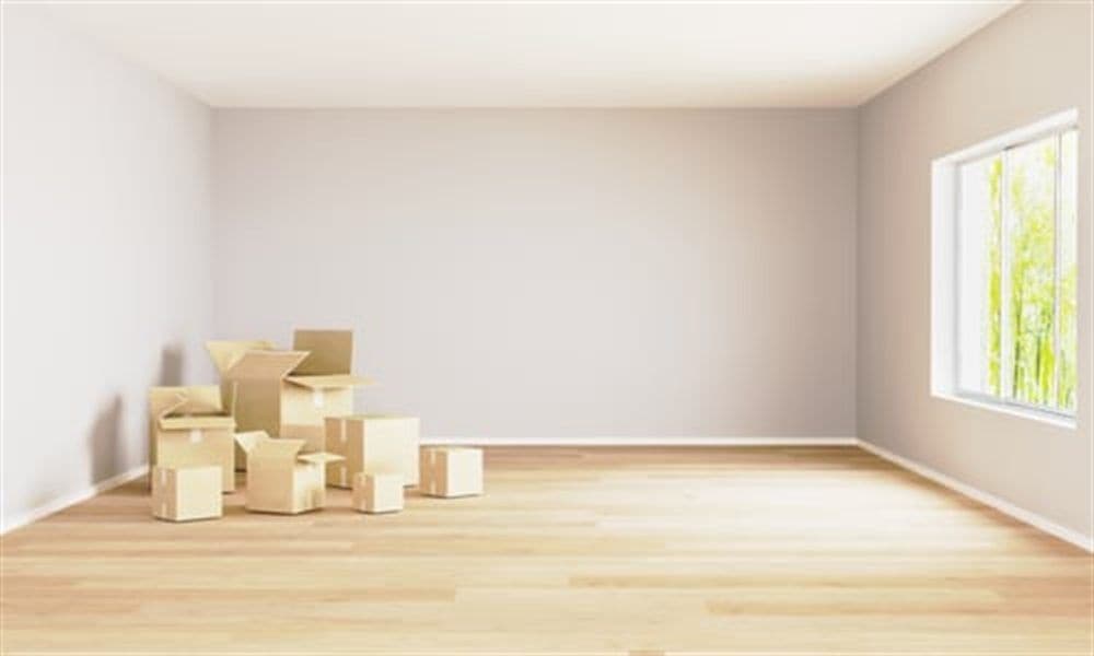 Empty room with moving boxes ready for AHC move-out cleaning in Illinois